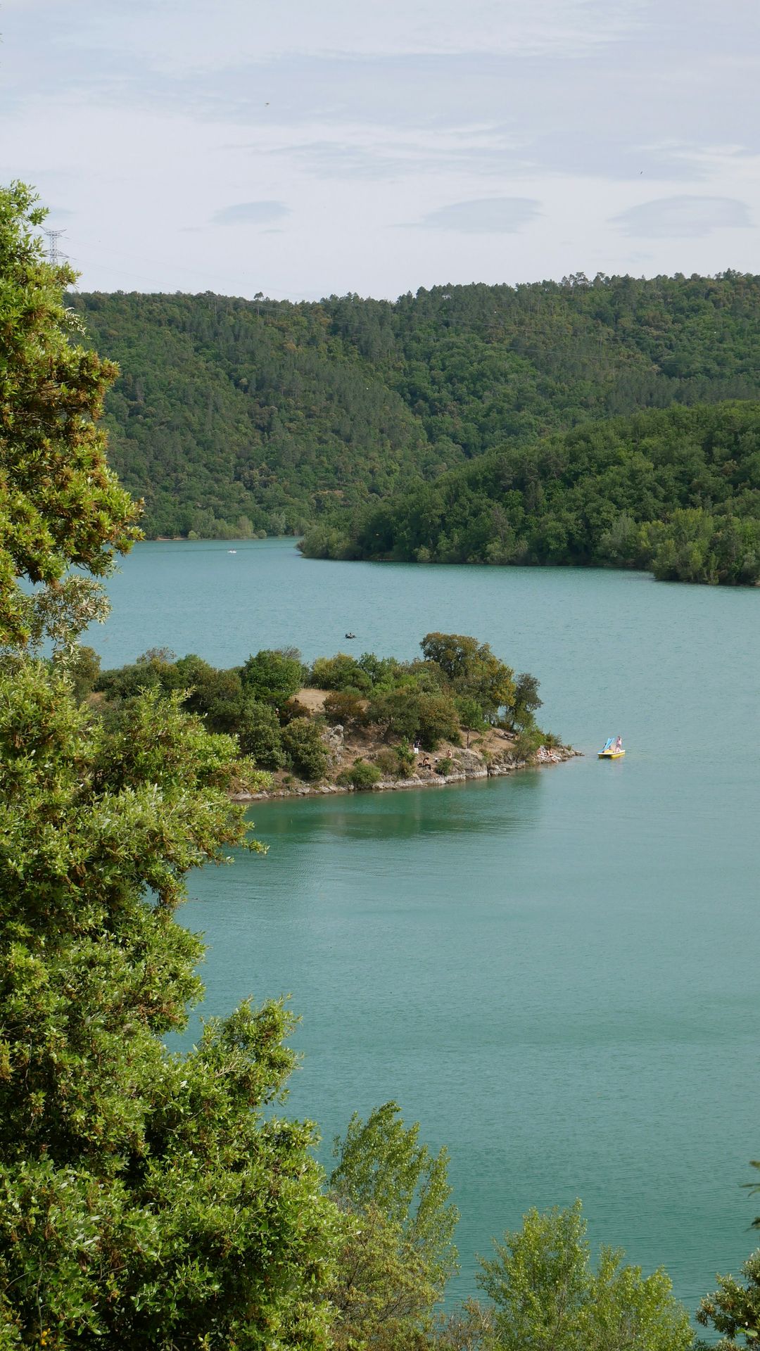 person riding on boat on lake during daytime